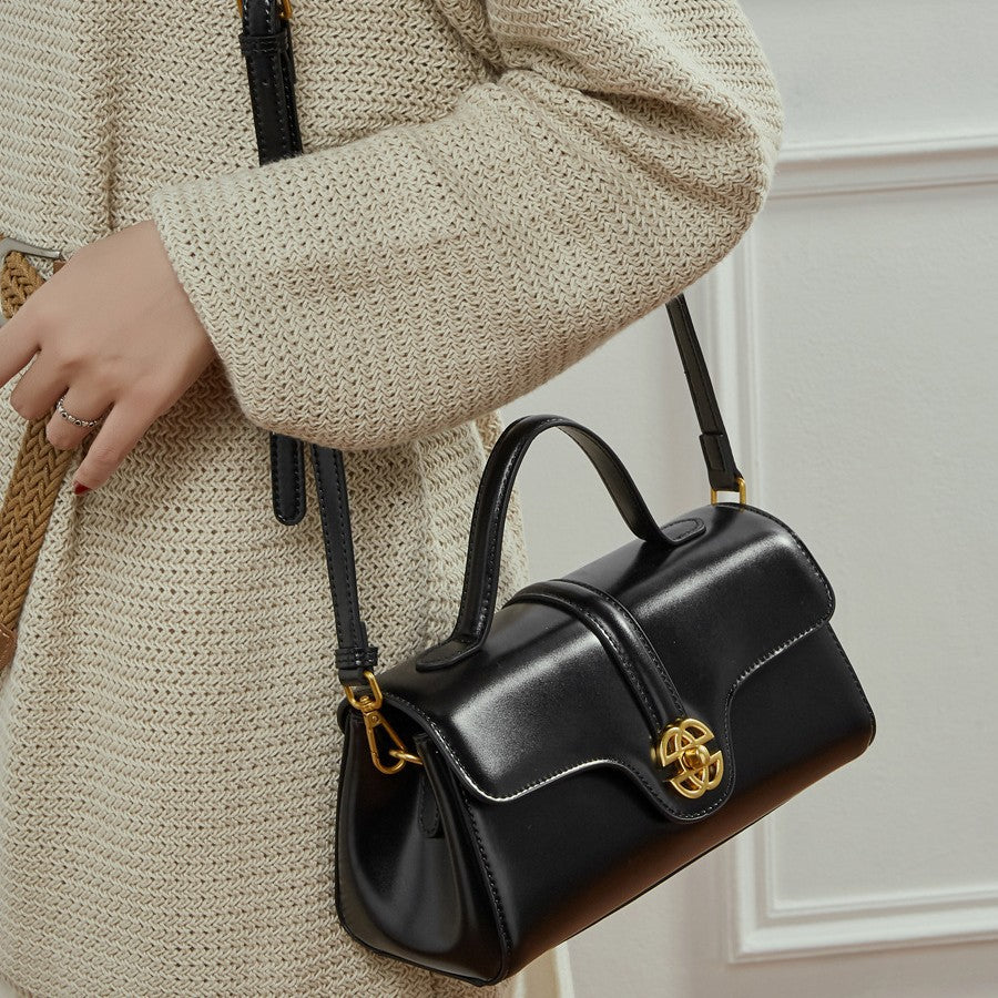  Bolsa de couro com fecho para mulheres.