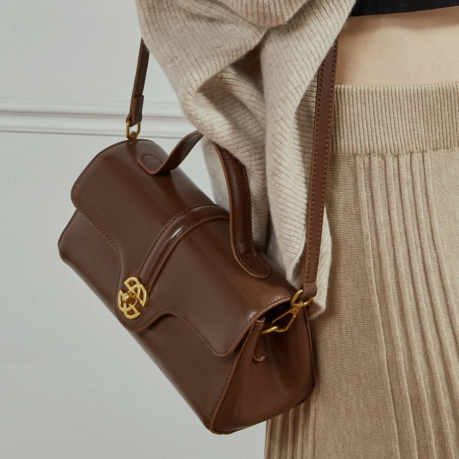  Bolsa de couro com fecho para mulheres.