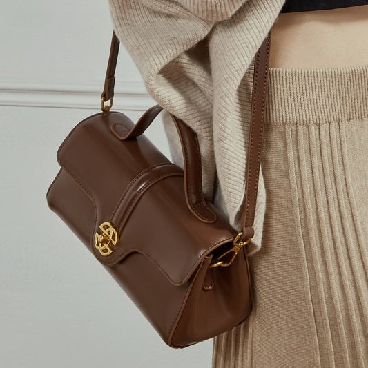  Bolsa de couro com fecho para mulheres.